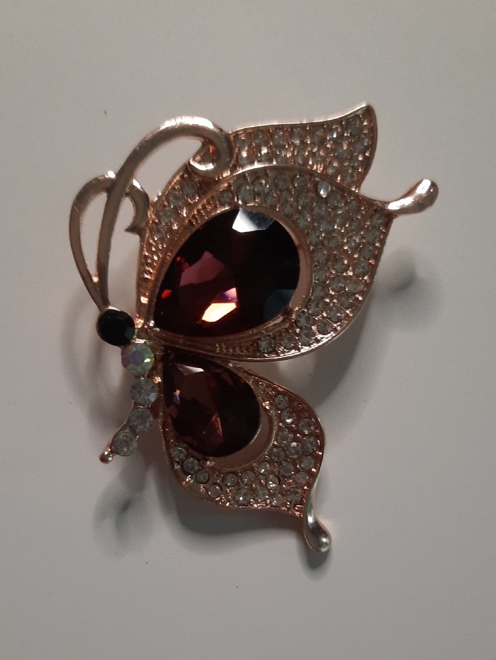 Elegant Rose Gold Butterfly Brooch with Deep Garnet Crystals